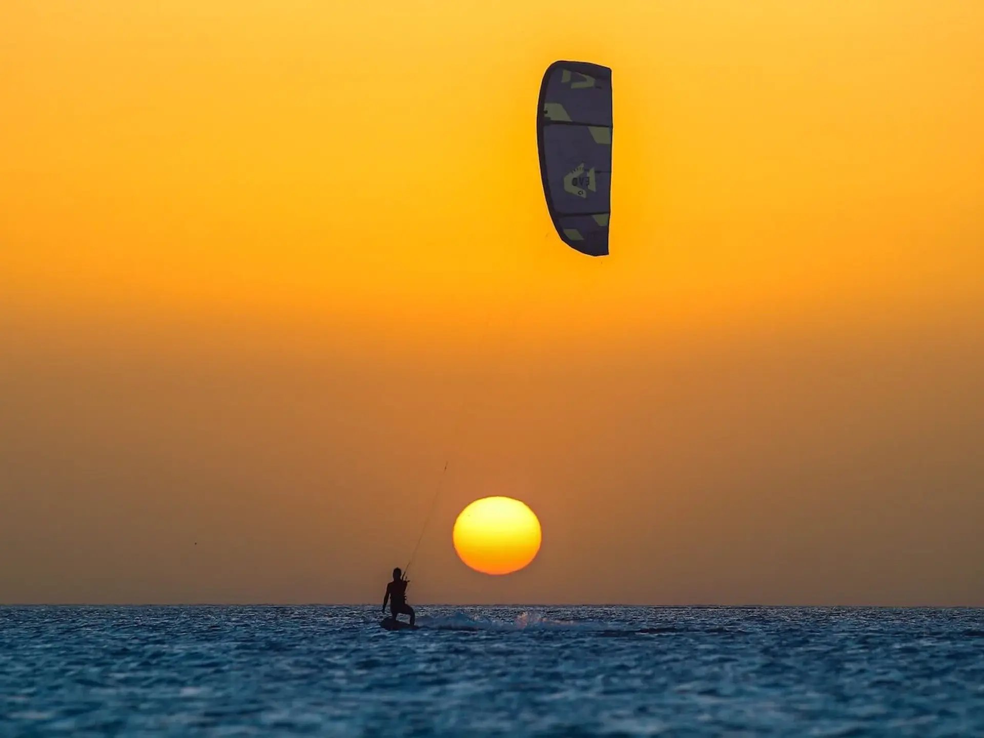 Kitesafari kitesurfers in turquoise lagoon