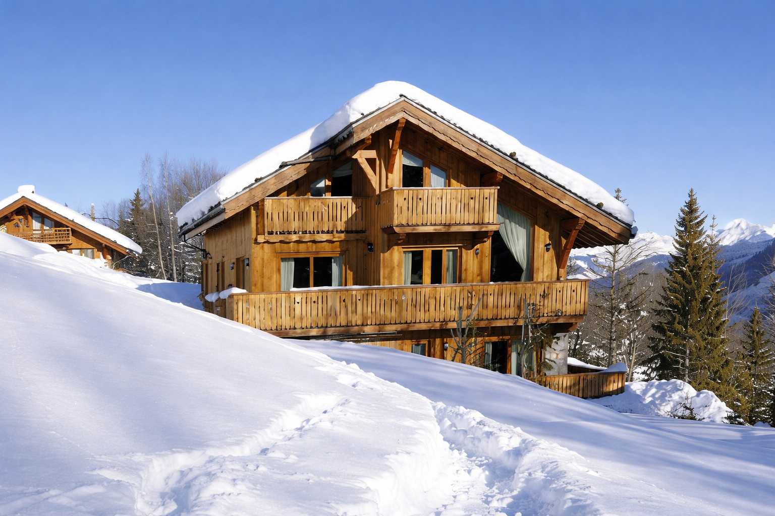 Meribel chalet exterior in deep snow with mountain views