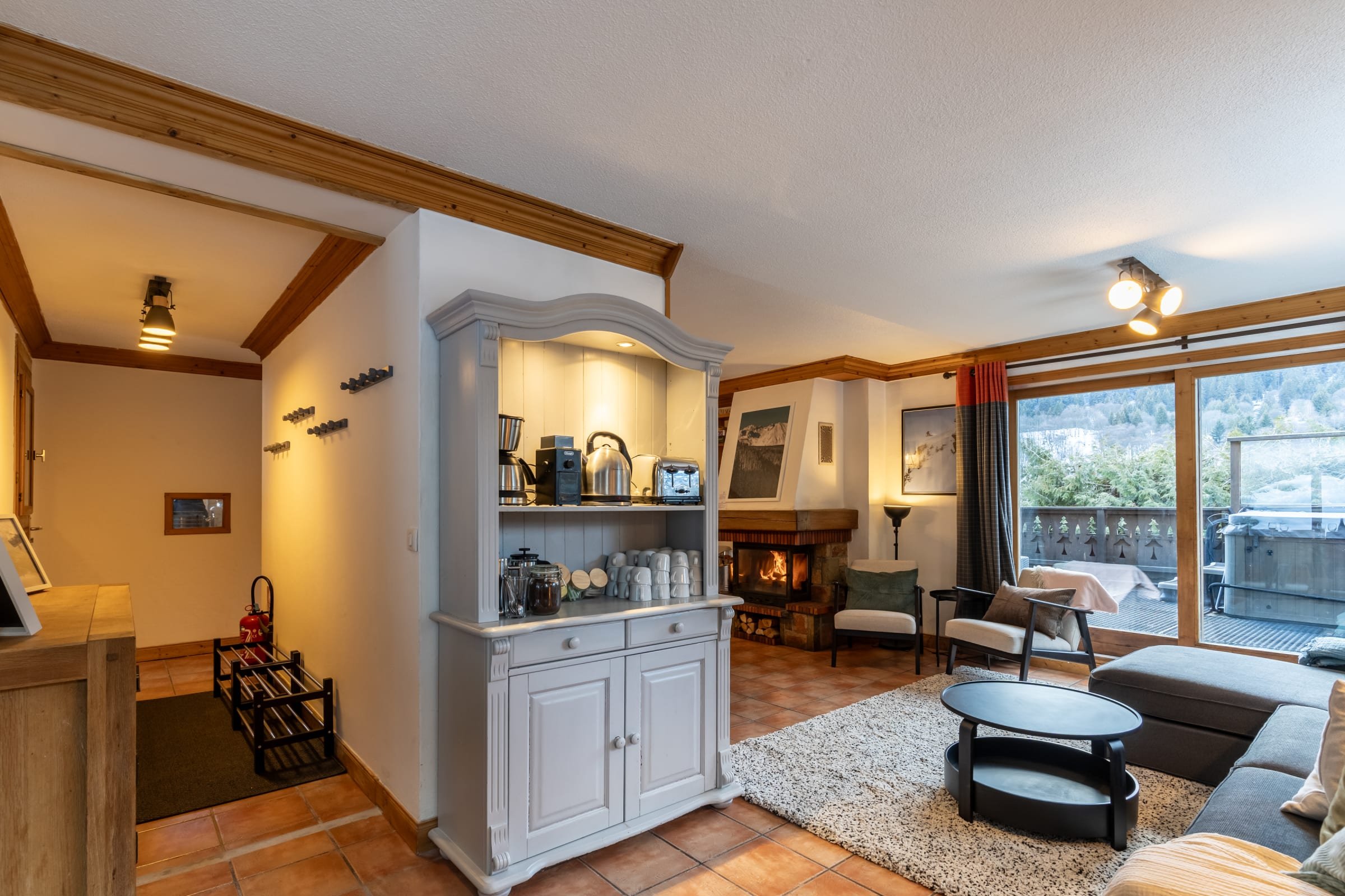 Meribel chalet living room with fireplace and mountain view