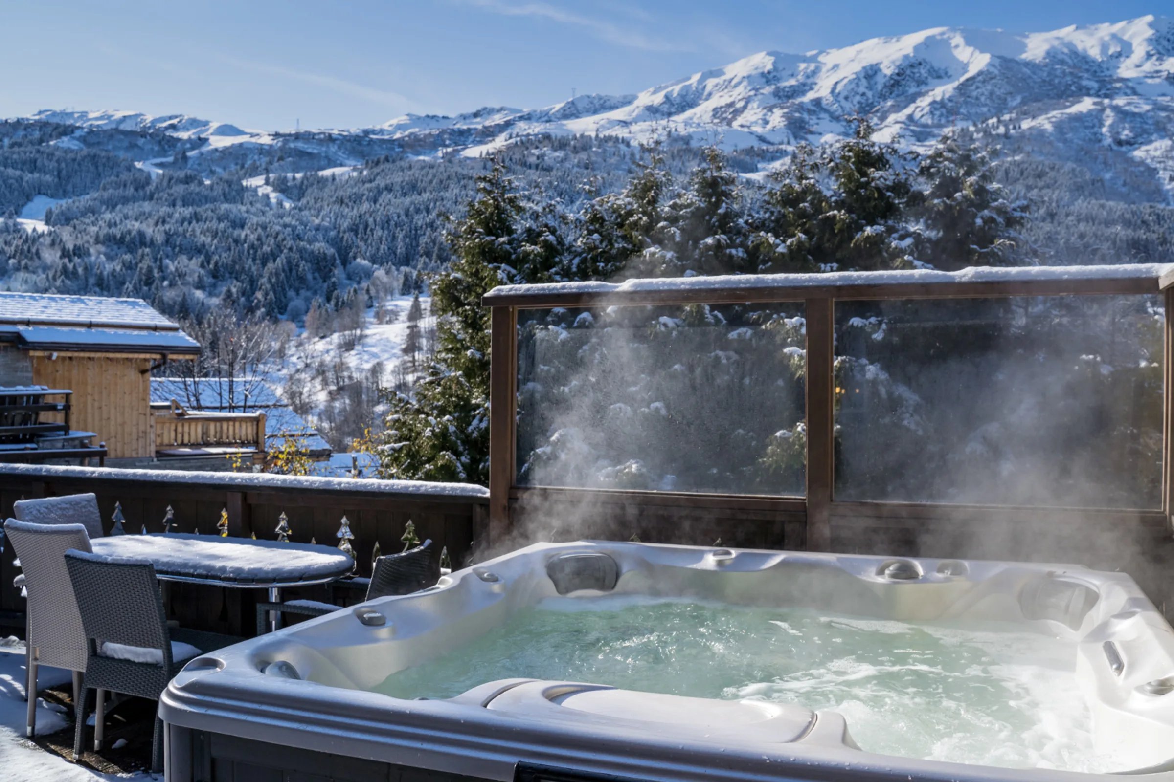 Meribel chalet jacuzzi with snowy mountain panorama