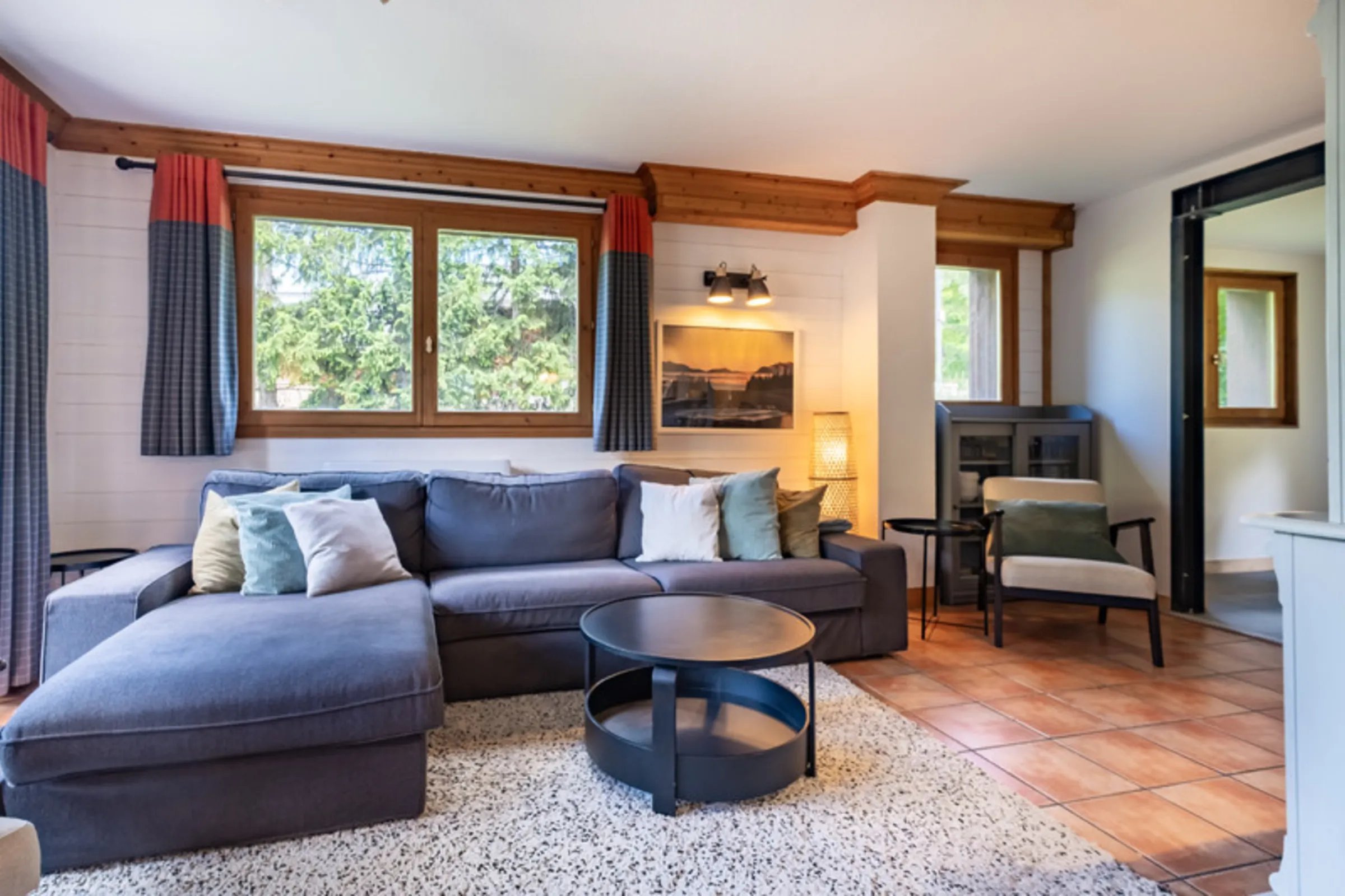 Meribel chalet cozy living room with garden view