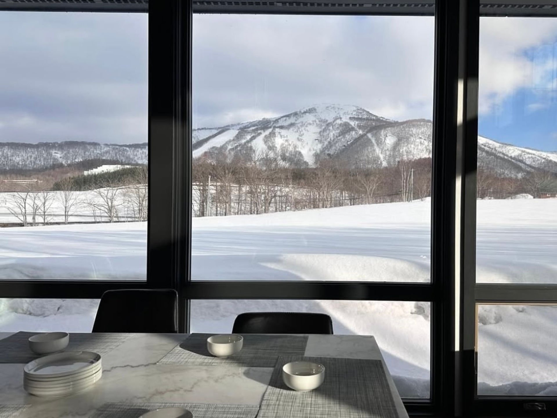 Niseko chalet dining with mountain views