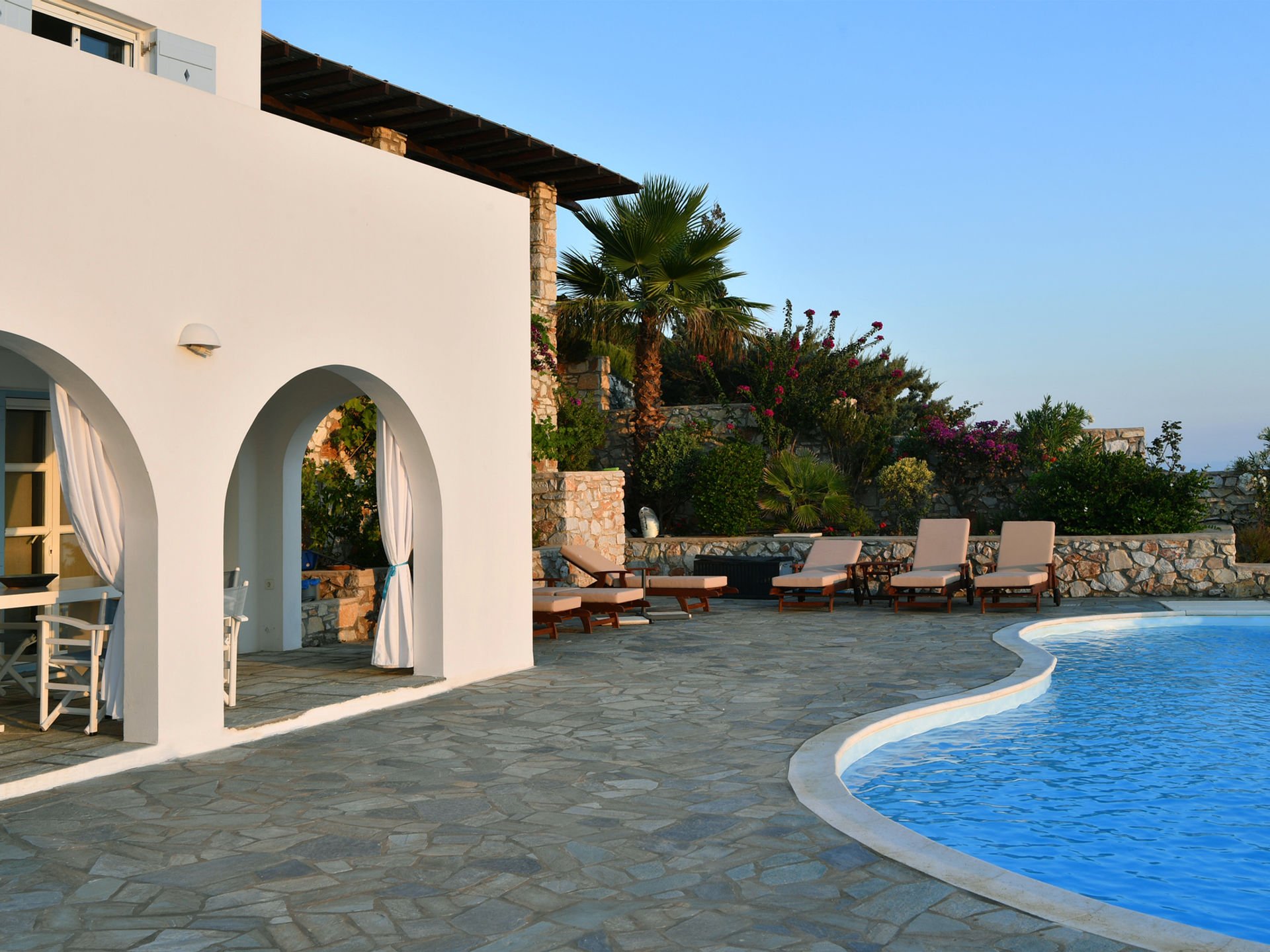Paros villa poolside terrace with Aegean views