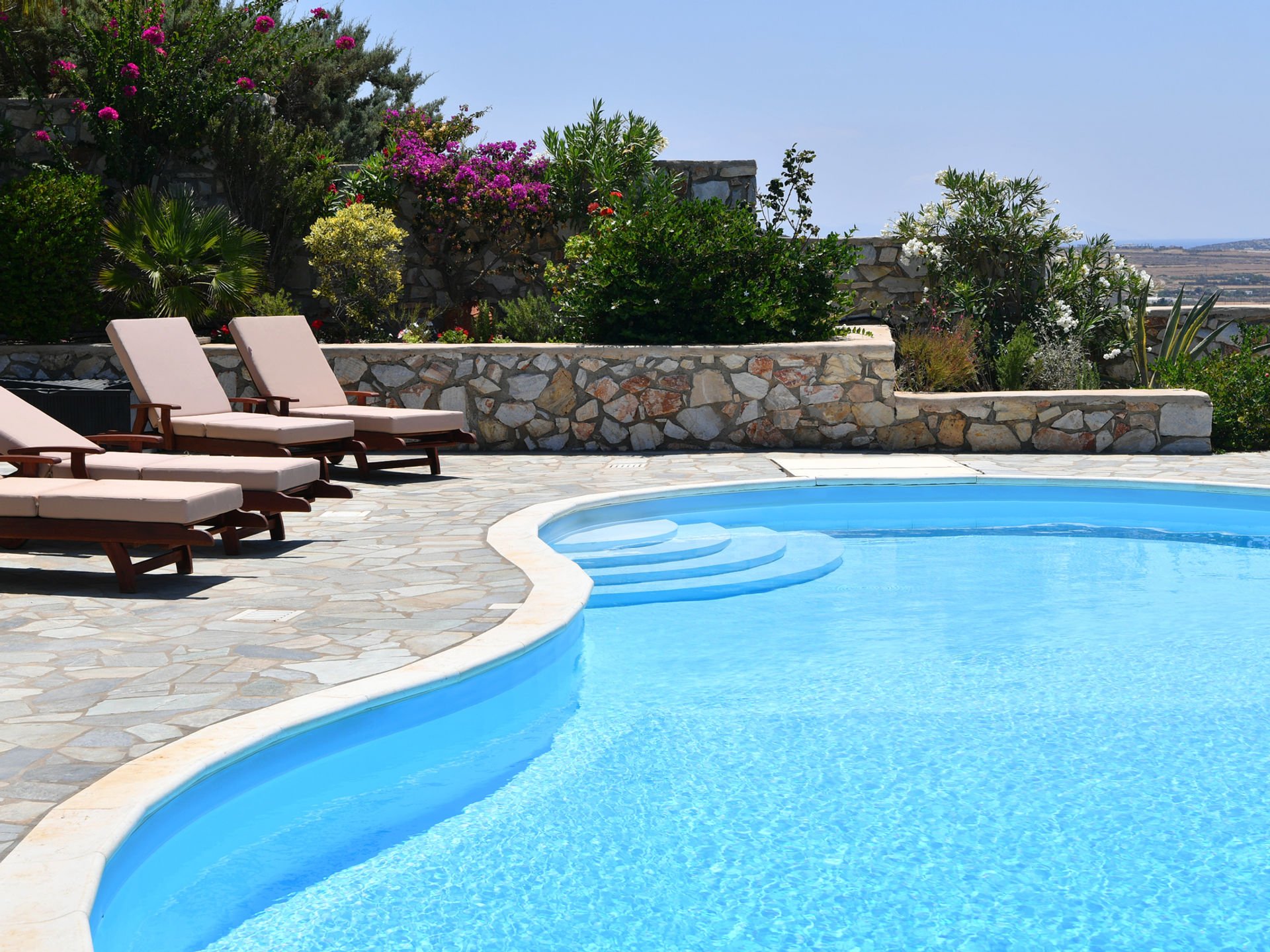 Paros villa pool loungers with sea view