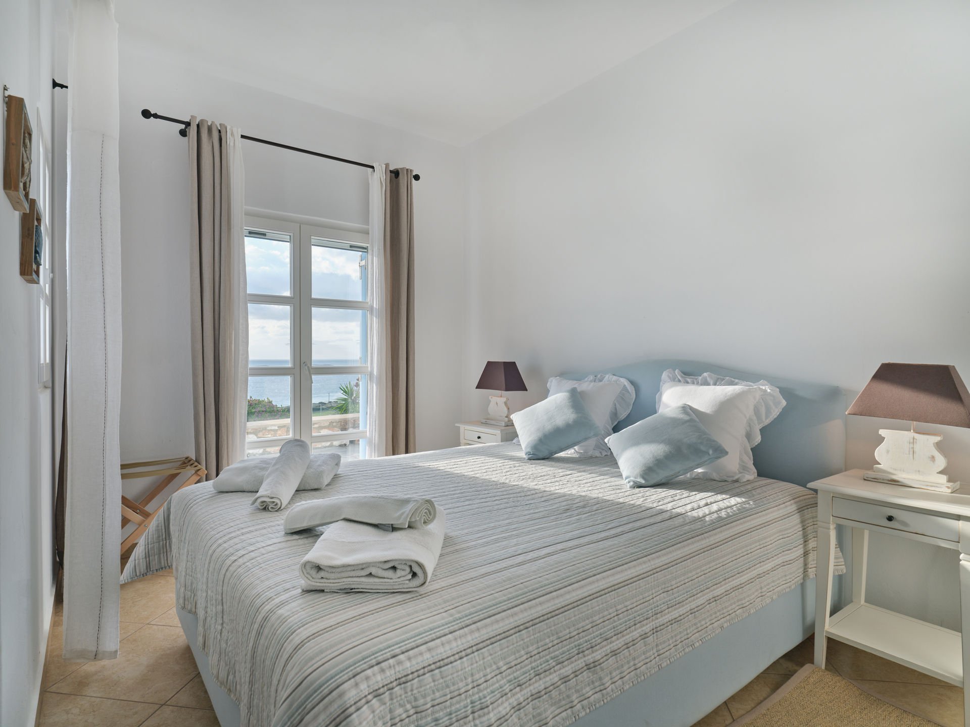 Paros villa bedroom with blue headboard