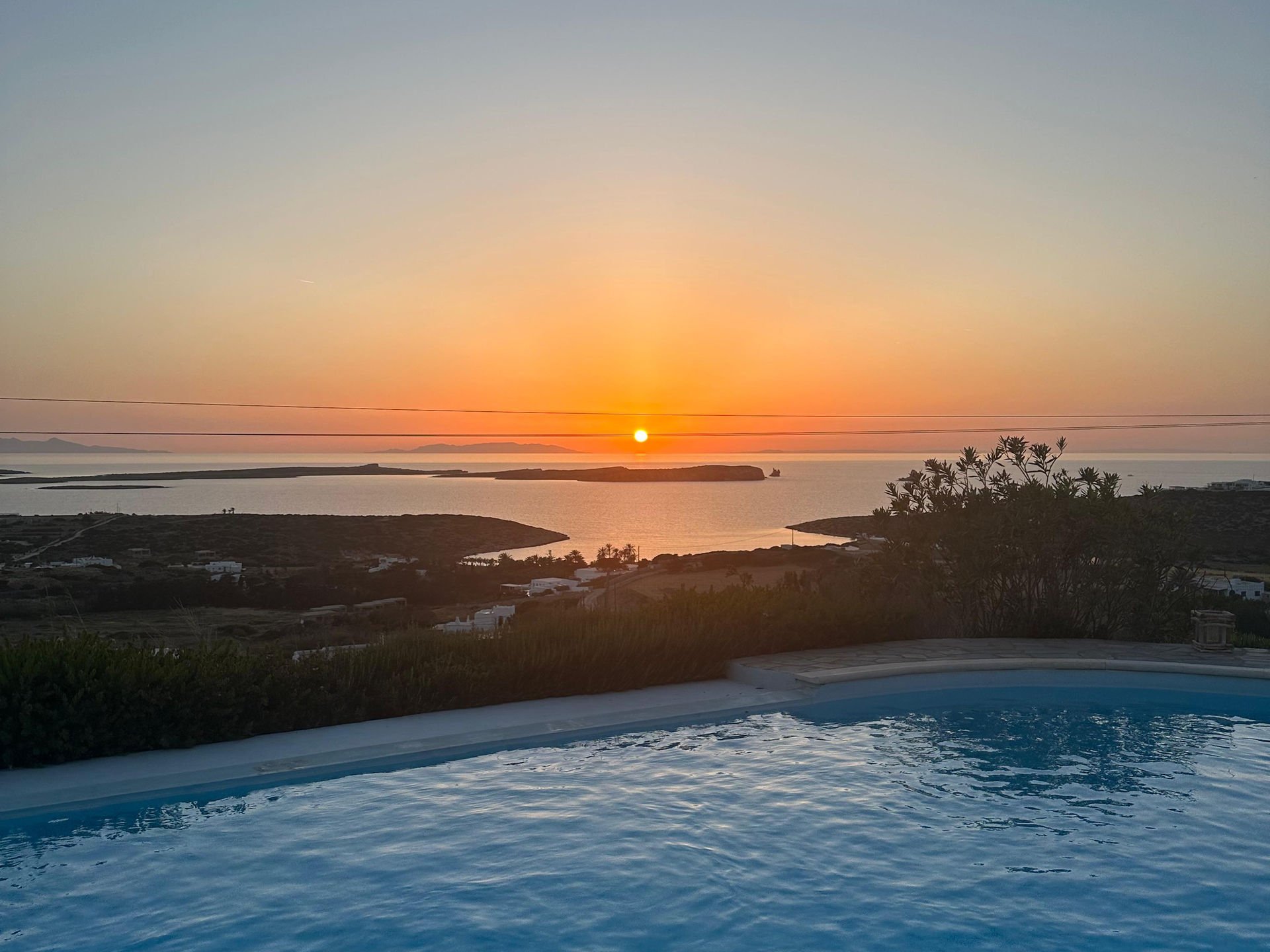 Paros villa sunset panorama over pool