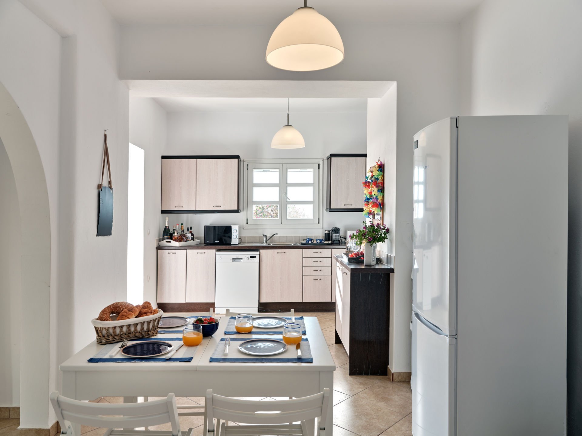 Paros villa kitchen through archway