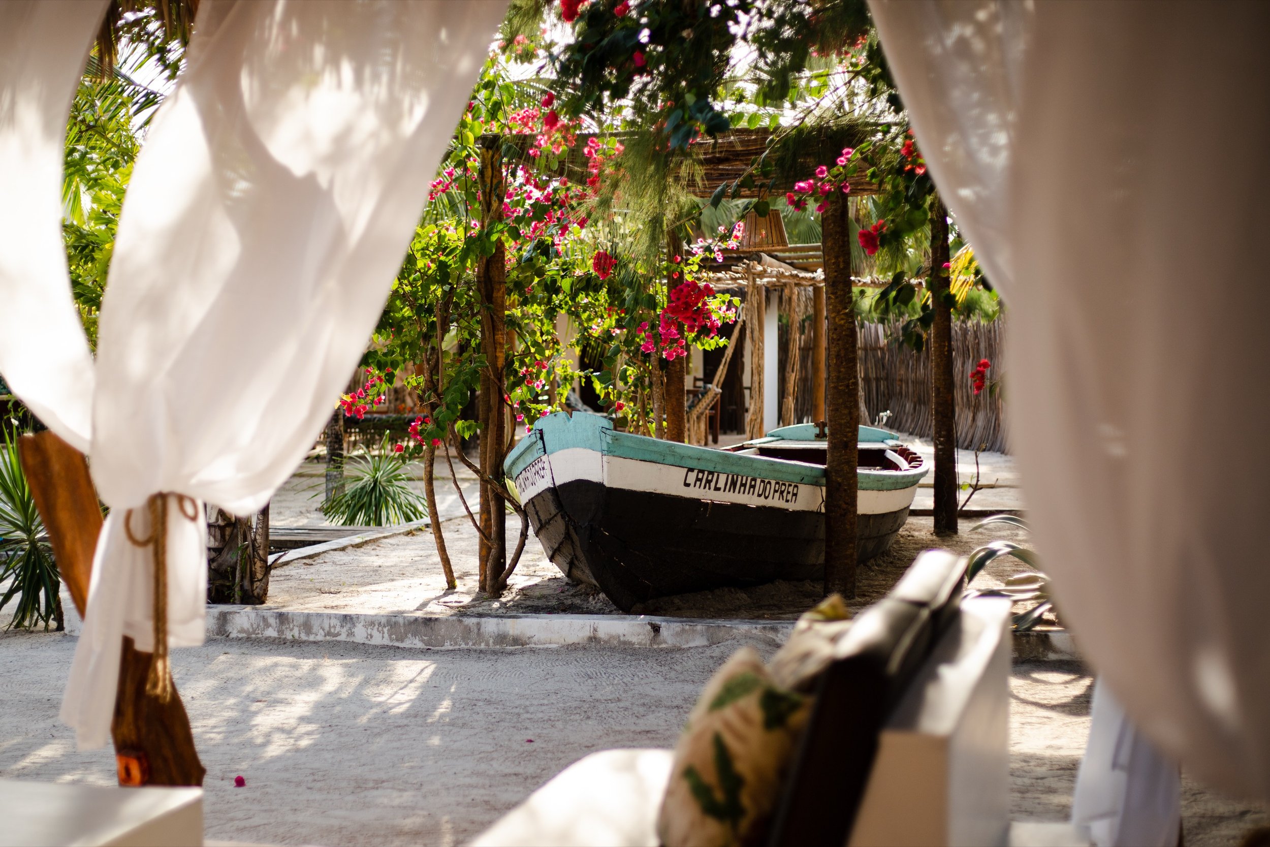 Prea villa garden with boat and bougainvillea