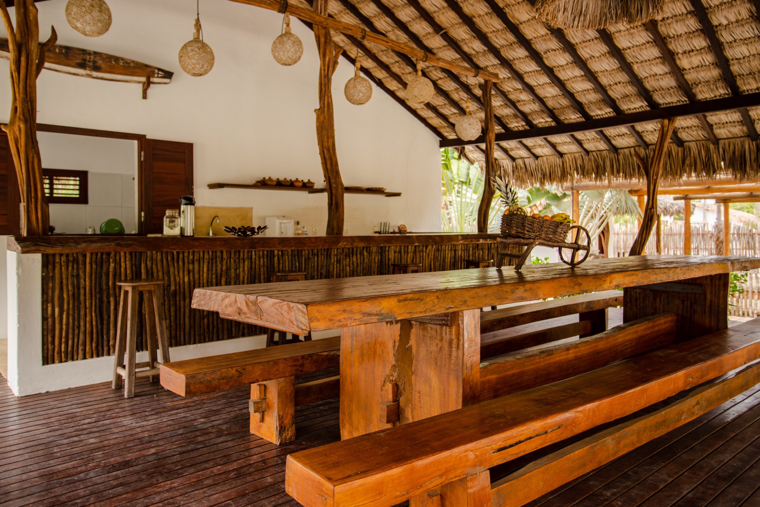 Prea villa communal dining under thatched roof