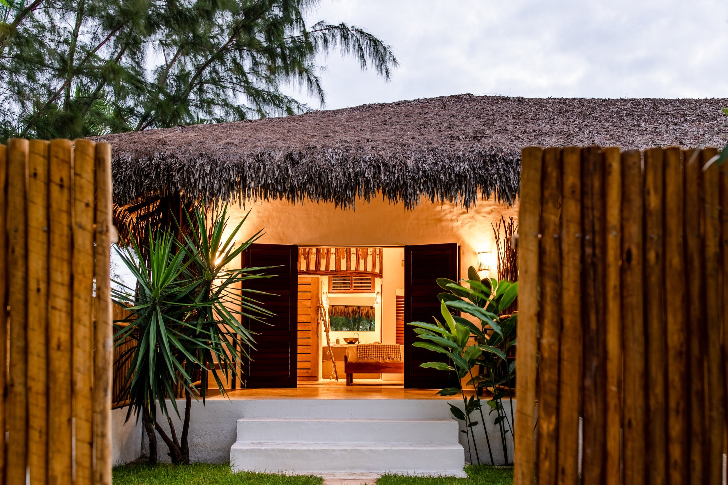 Prea villa bungalow entrance at dusk