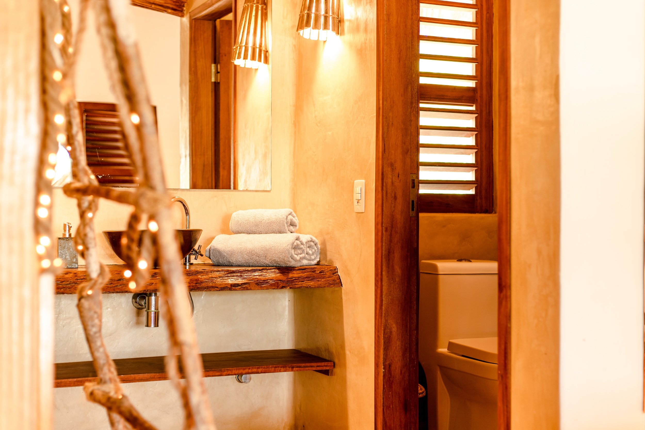 Prea villa bathroom with warm lighting