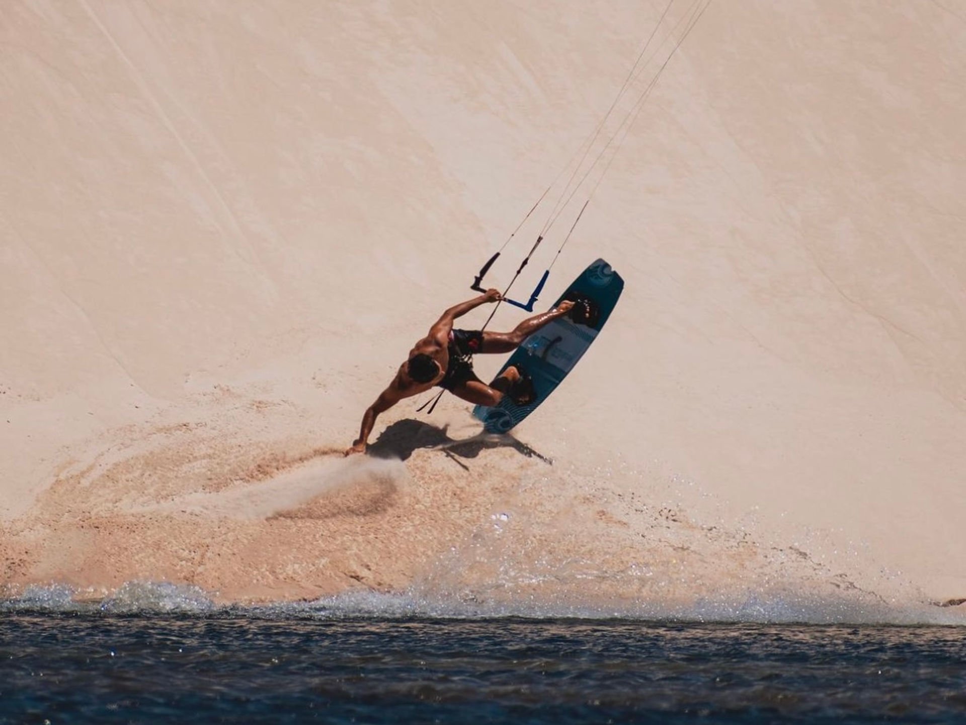 Prea kitesurfer launching from dune