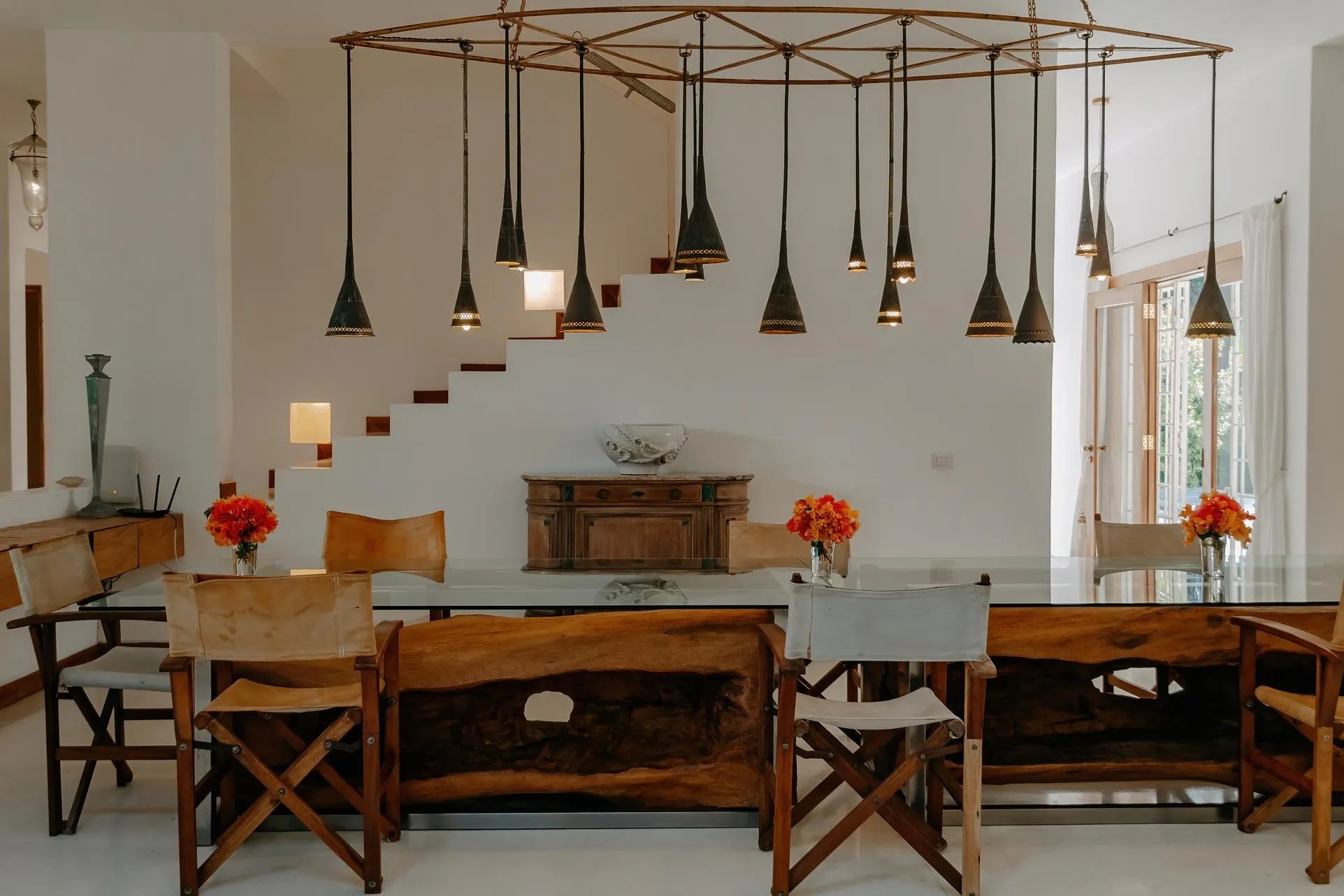 Watamu villa dining room with dramatic pendant lights