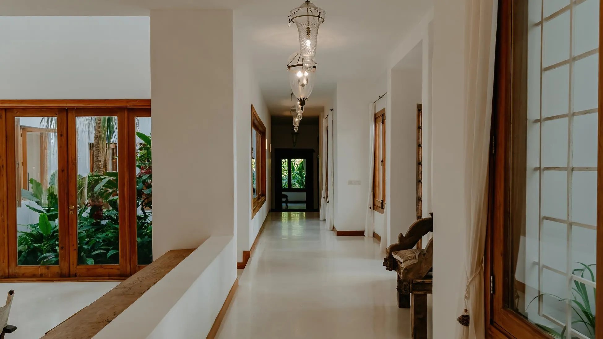 Watamu villa hallway with lantern lights and wooden accents