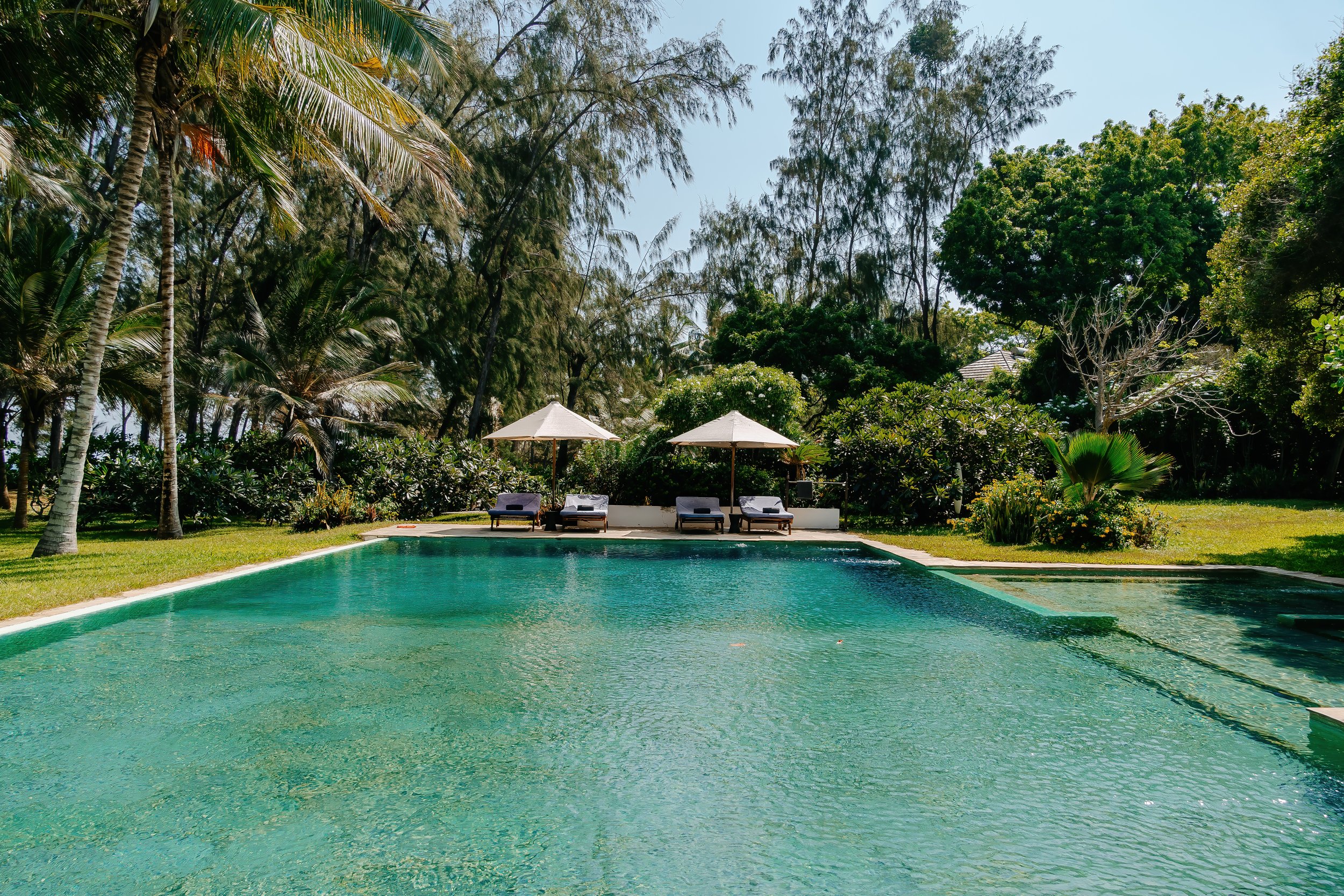 Watamu villa pool with sunbeds and tropical garden
