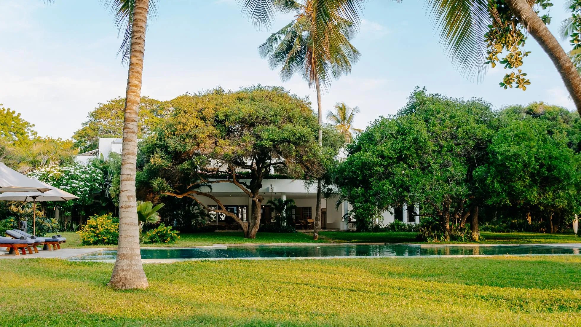 Watamu villa exterior with lush garden and pool