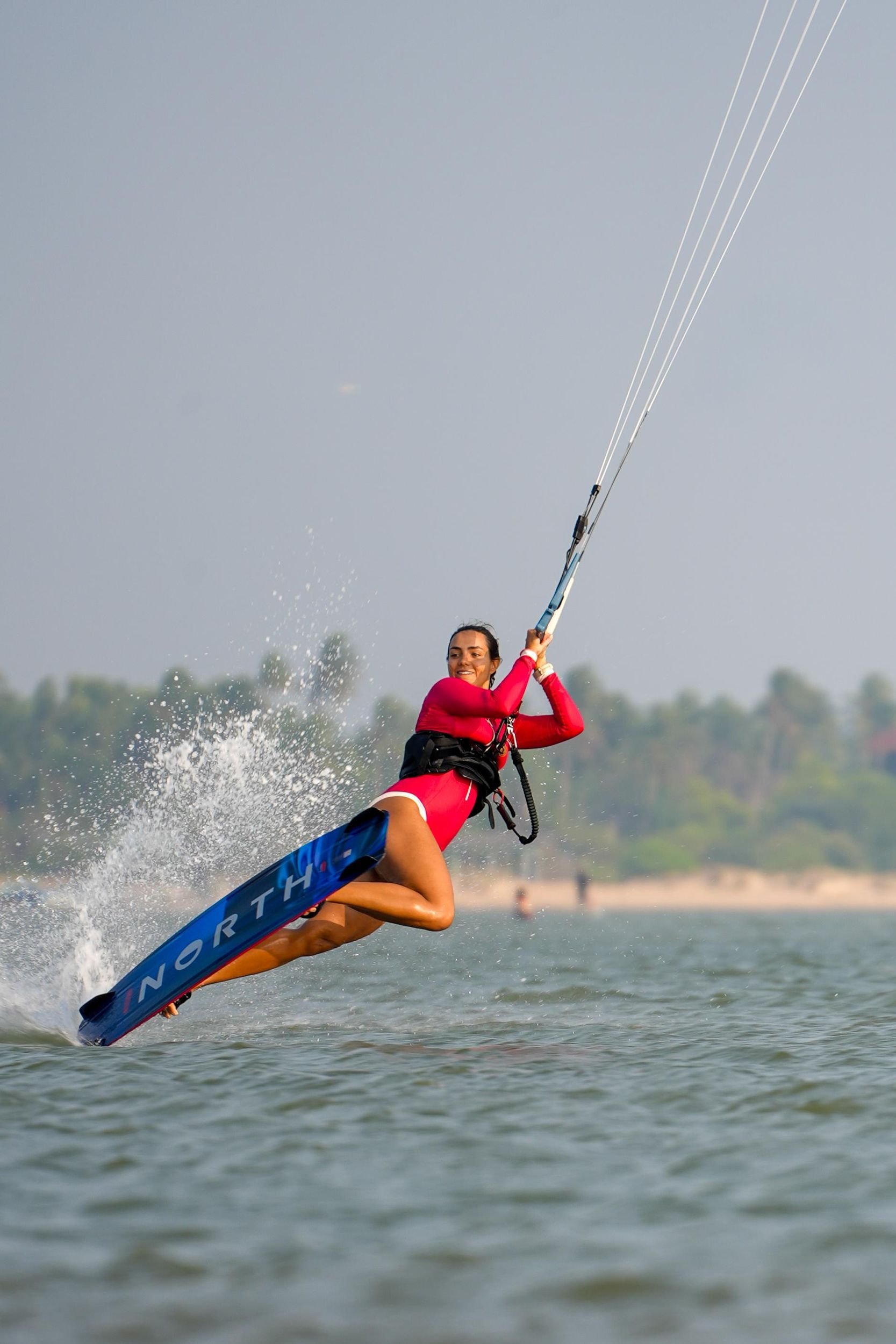 Kitesurfing through a wave