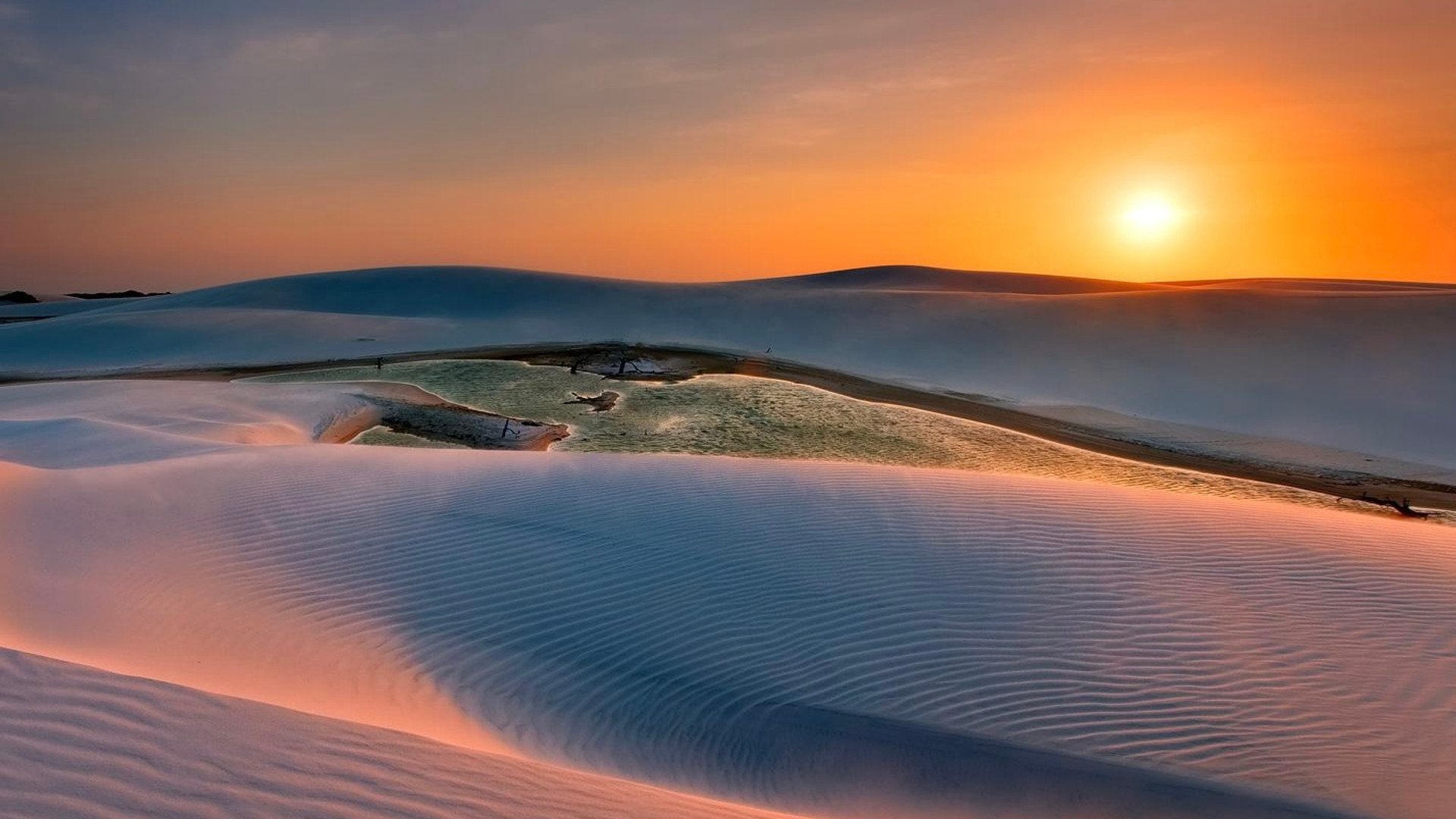 Desert dunes at sunset
